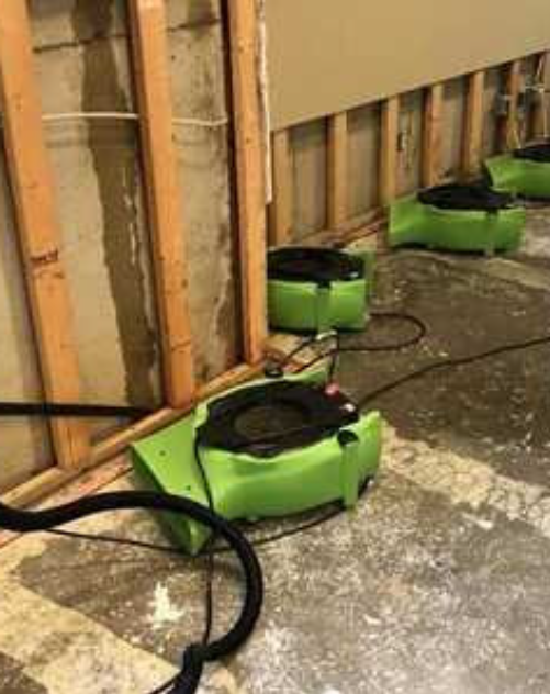 Structural drying equipment along exposed wall framing